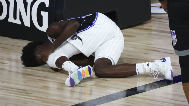 LAKE BUENA VISTA, FLORIDA - AUGUST 02: Jonathan Isaac #1 of the Orlando Magic reacts after an injury against the Sacramento Kings in the second half of a NBA basketball game at HP Field House at ESPN Wide World Of Sports Complex on August 2, 2020 in Lake Buena Vista, Florida.