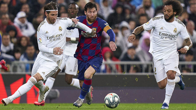 MADRID, SPAIN - MARCH 01: Sergio Ramos of Real Madrid CF battle for the ball with Lionel Messi of FC Barcelona during the Liga match between Real Madrid CF and FC Barcelona at Estadio Santiago Bernabeu on March 01, 2020 in Madrid, Spain.