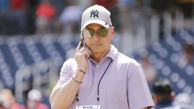 WEST PALM BEACH, FLORIDA - MARCH 12: New York Yankees general manager Brian Cashman talks on the phone prior to a Grapefruit League spring training game between the Washington Nationals and the New York Yankees at FITTEAM Ballpark of The Palm Beaches on March 12, 2020 in West Palm Beach, Florida. Many professional and college sports are canceling or postponing their games due to the ongoing threat of the Coronavirus (COVID-19) outbreak.