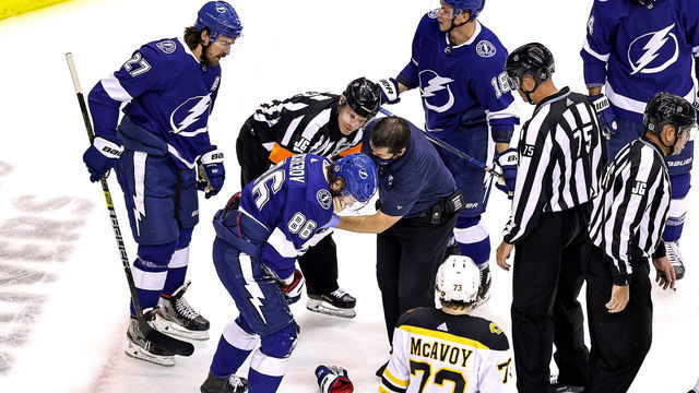 TORONTO, ONTARIO - AUGUST 31: Nikita Kucherov #86 of the Tampa Bay Lightning is tended to by the trainer after sustaining an injury on a high-sticking penalty by Zdeno Chara (not pictured) of the Boston Bruins during the first period in Game Five of the Eastern Conference Second Round during the 2020 NHL Stanley Cup Playoffs at Scotiabank Arena on August 31, 2020 in Toronto, Ontario.