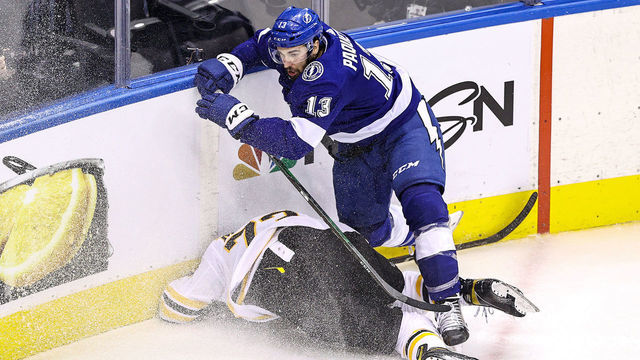 TORONTO, ONTARIO - AUGUST 31: Charlie McAvoy #73 of the Boston Bruins is checked into the boards by Cedric Paquette #13 of the Tampa Bay Lightning during the third period in Game Five of the Eastern Conference Second Round during the 2020 NHL Stanley Cup Playoffs at Scotiabank Arena on August 31, 2020 in Toronto, Ontario.