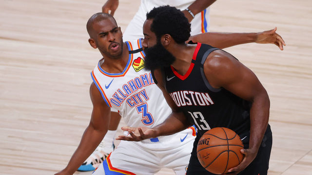 LAKE BUENA VISTA, FLORIDA - AUGUST 24: James Harden #13 of the Houston Rockets draws a foul from Chris Paul #3 of the Oklahoma City Thunder during the second quarter in Game Four of the Western Conference First Round during the 2020 NBA Playoffs at AdventHealth Arena at ESPN Wide World Of Sports Complex on August 24, 2020 in Lake Buena Vista, Florida.