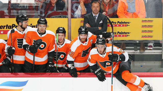 PHILADELPHIA, PA - OCTOBER 09: Head Coach of the Philadelphia Flyers Alain Vigneault with Scott Laughton #21, Carsen Twarynski #81, James van Riemsdyk #25, Claude Giroux #28 and Kevin Hayes #13 watch as play develops in the first period against the New Jersey Devils on October 9, 2019 at the Wells Fargo Center in Philadelphia, Pennsylvania.