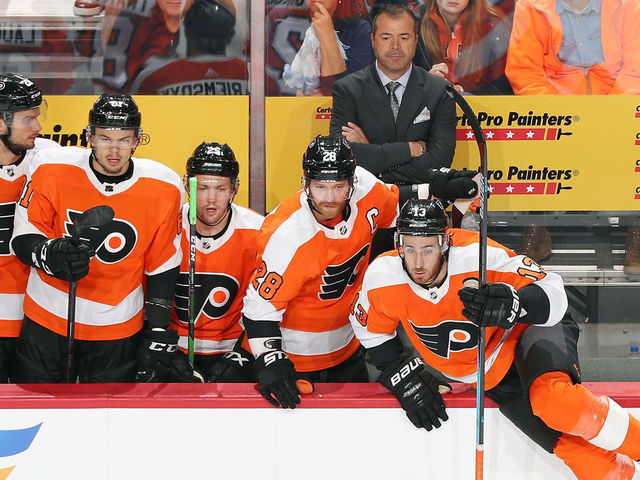 PHILADELPHIA, PA - OCTOBER 09: Head Coach of the Philadelphia Flyers Alain Vigneault with Scott Laughton #21, Carsen Twarynski #81, James van Riemsdyk #25, Claude Giroux #28 and Kevin Hayes #13 watch as play develops in the first period against the New Jersey Devils on October 9, 2019 at the Wells Fargo Center in Philadelphia, Pennsylvania.