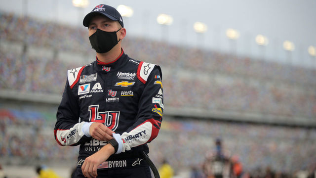 DAYTONA BEACH, FLORIDA - AUGUST 29: William Byron, driver of the #24 Liberty University Chevrolet, stands on the grid prior to the NASCAR Cup Series Coke Zero Sugar 400 at Daytona International Speedway on August 29, 2020 in Daytona Beach, Florida.