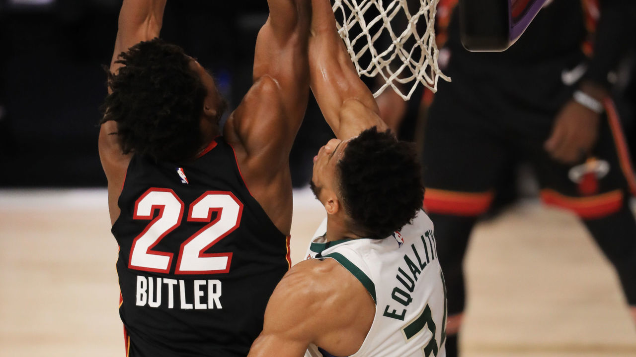 LAKE BUENA VISTA, FLORIDA - AUGUST 31: Jimmy Butler #22 of the Miami Heat drives to the basket as Giannis Antetokounmpo #34 of the Milwaukee Bucks defends during the first quarter in Game One of the Eastern Conference Second Round during the 2020 NBA Playoffs at the Field House at ESPN Wide World Of Sports Complex on August 31, 2020 in Lake Buena Vista, Florida.