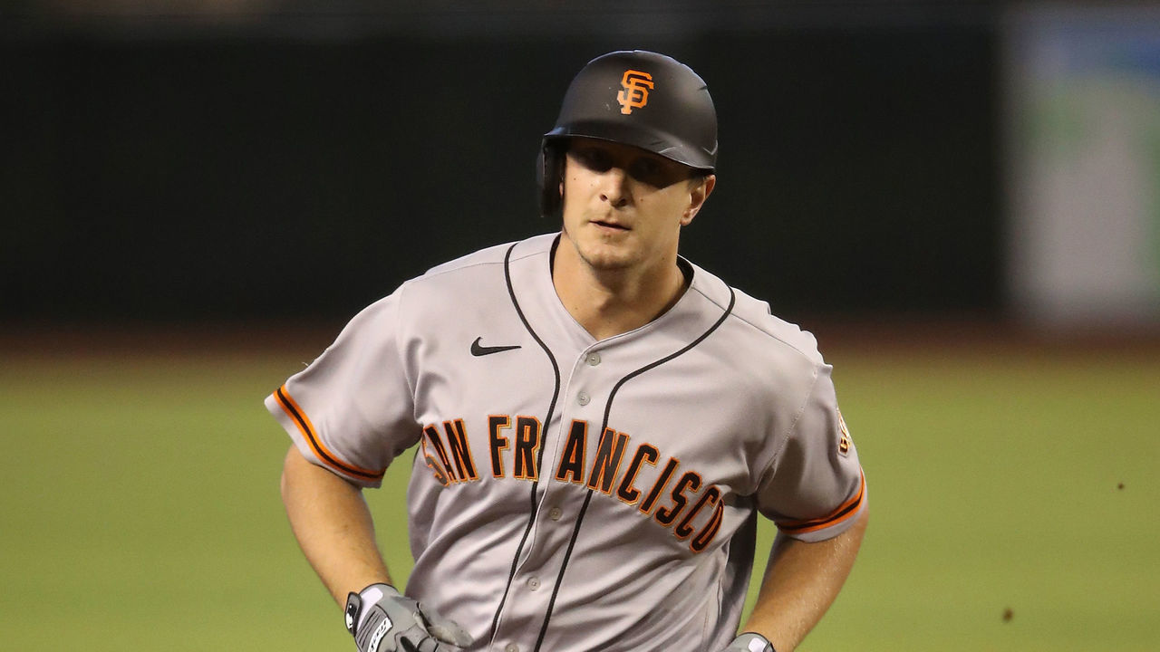 PHOENIX, ARIZONA - AUGUST 30: Alex Dickerson #42 of the San Francisco Giants rounds the bases after hitting a solo home run against the Arizona Diamondbacks during the first inning of the MLB game at Chase Field on August 30, 2020 in Phoenix, Arizona. All uniformed players and coaches are wearing #42 in honor of Jackie Robinson Day. The day honoring Jackie Robinson, traditionally held on April 15, was rescheduled due to the COVID-19 pandemic.