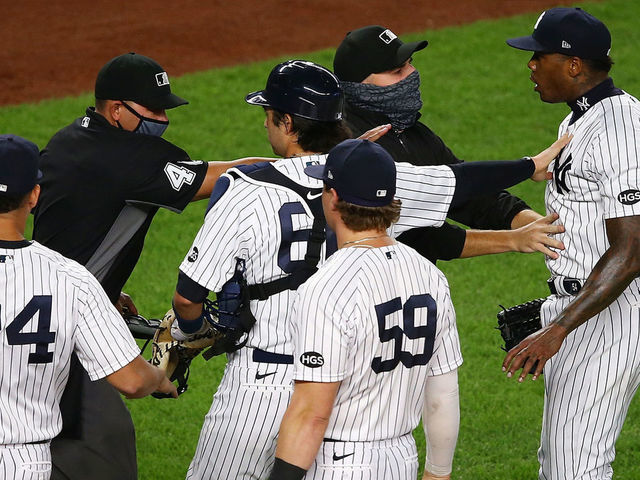 NEW YORK, NEW YORK - SEPTEMBER 01: Aroldis Chapman #54 of the New York Yankees exchanges words with the Tampa Bay Rays after the final out in the ninth inning at Yankee Stadium on September 01, 2020 in New York City.