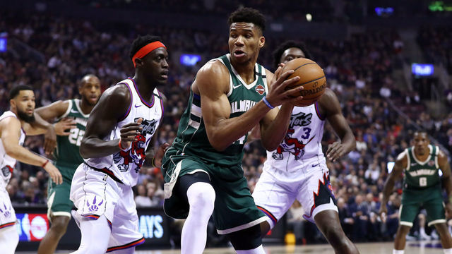 TORONTO, ON - FEBRUARY 25: Giannis Antetokounmpo #34 of the Milwaukee Bucks dribbles the ball as Pascal Siakam #43 of the Toronto Raptors defends during the first half of an NBA game at Scotiabank Arena on February 25, 2020 in Toronto, Canada.