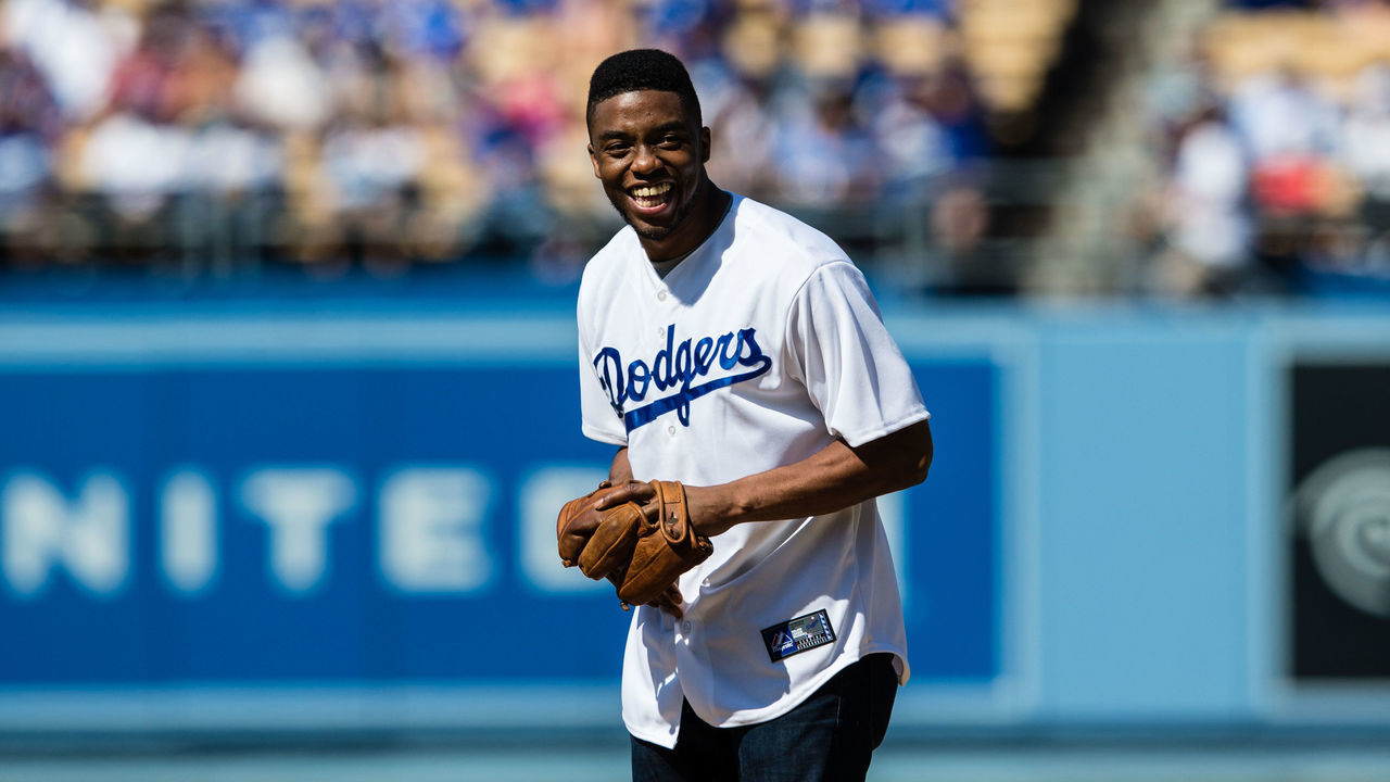 LOS ANGELES, CA - JULY 13: Chadwick Boseman, the actor who plays Jackie Robinson in the movie "42," laughs as he gets ready to throw out the celebratory first pitch before the Los Angeles Dodgers game against the Colorado Rockies on July 13, 2013 at Dodger Stadium in Los Angeles, California. The Dodgers won the game 1-0.