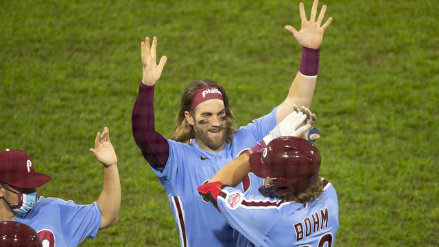 PHILADELPHIA, PA - SEPTEMBER 03: Alec Bohm #28 of the Philadelphia Phillies celebrates with Bryce Harper #3 after hitting a walk off sacrifice fly in the bottom of the tenth inning against the Washington Nationals at Citizens Bank Park on September 3, 2020 in Philadelphia, Pennsylvania. The Phillies defeated the Nationals 6-5 in extra innings.
