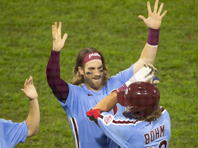 PHILADELPHIA, PA - SEPTEMBER 03: Alec Bohm #28 of the Philadelphia Phillies celebrates with Bryce Harper #3 after hitting a walk off sacrifice fly in the bottom of the tenth inning against the Washington Nationals at Citizens Bank Park on September 3, 2020 in Philadelphia, Pennsylvania. The Phillies defeated the Nationals 6-5 in extra innings.