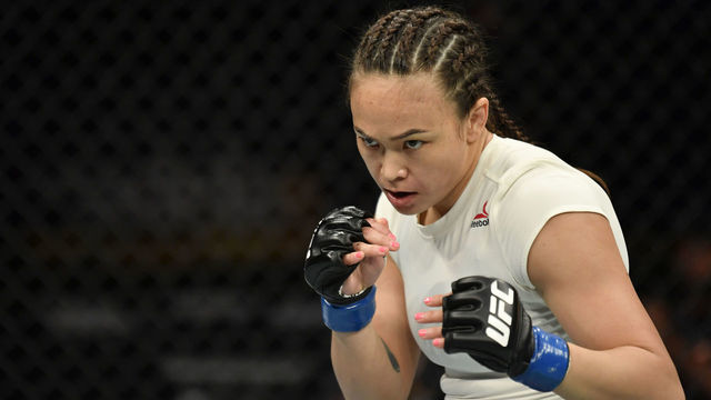 JACKSONVILLE, FLORIDA - MAY 09: Michelle Waterson battles Carla Esparza in their strawweight fight during the UFC 249 event at VyStar Veterans Memorial Arena on May 09, 2020 in Jacksonville, Florida.