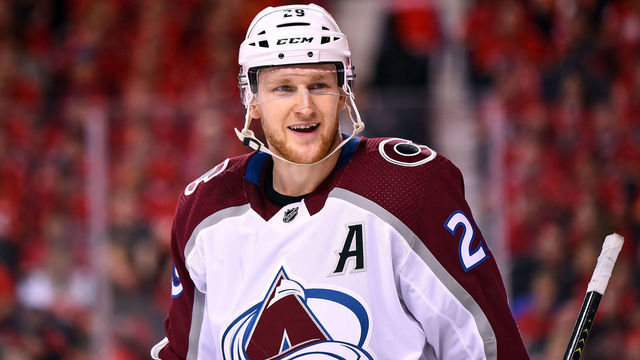 CALGARY, AB - APRIL 13: Colorado Avalanche Center Nathan MacKinnon (29) smiles during the second period of Game Two of the Western Conference First Round during the 2019 Stanley Cup Playoffs where the Calgary Flames hosted the Colorado Avalanche on April 13, 2019, at the Scotiabank Saddledome in Calgary, AB.