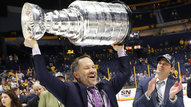 NASHVILLE, TN - JUNE 11: VP of Hockey Operations Jason Karmanos of the Pittsburgh Penguins carries the Stanley Cup after his teams 2-0 victory over the Nashville Predators to win Game Six of the 2017 NHL Stanley Cup Final at the Bridgestone Arena on June 11, 2017 in Nashville, Tennessee.