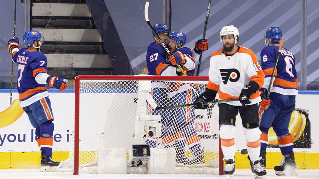 TORONTO, ONTARIO - SEPTEMBER 03: Jordan Eberle #7, Anders Lee #27, Mathew Barzal #13 and Ryan Pulock #6 of the New York Islanders celebrate as Matt Niskanen #15 of the Philadelphia Flyers looks on after Lee scored in the second period of Game Six of the Eastern Conference Second Round of the 2020 NHL Stanley Cup Playoff between the Philadelphia Flyers and the New York Islanders at Scotiabank Arena on September 03, 2020 in Toronto, Ontario.