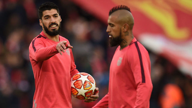 Barcelona's Uruguayan striker Luis Suarez (L) and Barcelona's Chilean midfielder Arturo Vidal warm up before the UEFA Champions league semi-final second leg football match between Liverpool and Barcelona at Anfield in Liverpool, north west England on May 7, 2019.