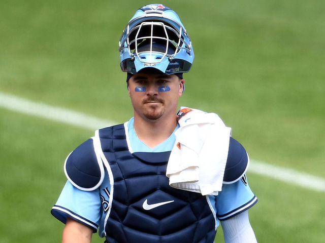 BALTIMORE, MD - AUGUST 19: Reese McGuire #10 of the Toronto Blue Jays walks to the dug out before a baseball game against the Baltimore Orioles at Oriole Park at Camden Yards on August 19, 2020 in Baltimore, Maryland.