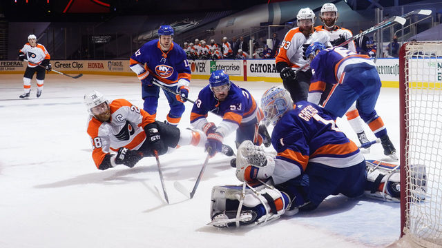 TORONTO, ONTARIO - AUGUST 30: Goaltender Thomas Greiss #1 of the New York Islanders makes a glove save on Claude Giroux #28 of the Philadelphia Flyers during the third period of Game Four of the Eastern Conference Second Round during the 2020 NHL Stanley Cup Playoffs at Scotiabank Arena on August 30, 2020 in Toronto, Ontario.