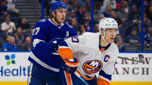 TAMPA, FL - DECEMBER 9: Ryan McDonagh #27 of the Tampa Bay Lightning skates against Anders Lee #27 of the New York Islanders during the second period at Amalie Arena on December 9, 2019 in Tampa, Florida. "n