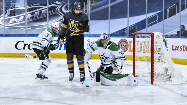 EDMONTON, ALBERTA - AUGUST 03: Alex Tuch #89 of the Vegas Golden Knights hops as Ben Bishop #30 of the Dallas Stars makes a save during the third period of a Round Robin game during the 2020 NHL Stanley Cup Playoff at Rogers Place on August 03, 2020 in Edmonton, Alberta.