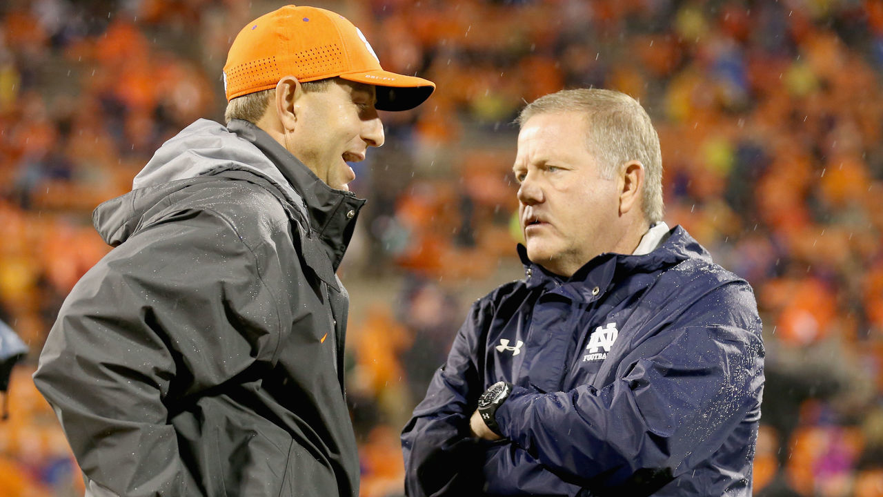 CLEMSON, SC - OCTOBER 03: (L-R) Head coach Dabo Swinney of the Clemson Tigers talks to head coach Brian Kelly of the Notre Dame Fighting Irish before their game at Clemson Memorial Stadium on October 3, 2015 in Clemson, South Carolina.