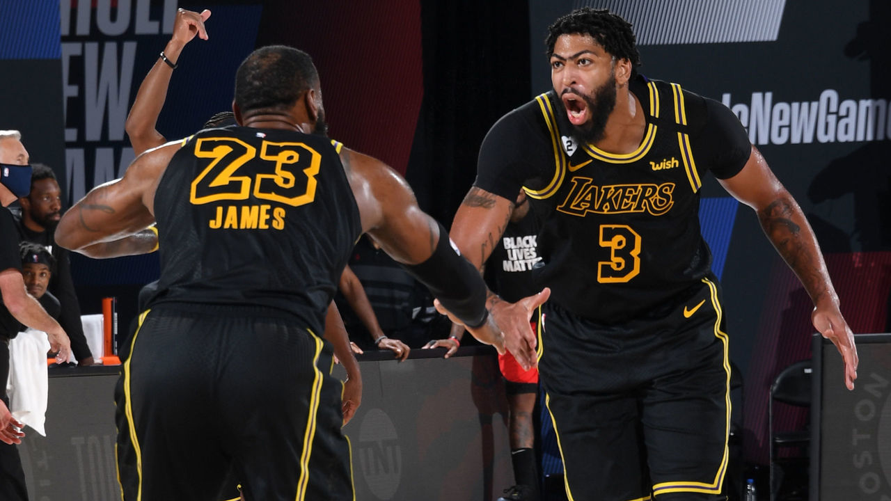 Orlando, FL - SEPTEMBER 6: LeBron James #23 and Anthony Davis #3 of the Los Angeles Lakers hi-five during the game against the Houston Rockets during Game Two of the Western Conference Semifinals on September 6, 2020 in Orlando, Florida at AdventHealth Arena. NOTE TO USER: User expressly acknowledges and agrees that, by downloading and/or using this Photograph, user is consenting to the terms and conditions of the Getty Images License Agreement. Mandatory Copyright Notice: Copyright 2020 NBAE