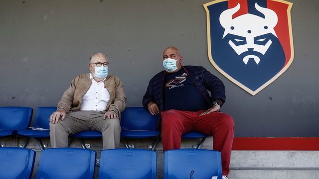 Caen football fans wearing a protective face mask attend the French L2 friendly football match between Caen and Paris FC at the Michel d'Ornano Stadium in Caen, northwestern France on July 11, 2020. - Today on July 11, 2020, the green light was given to football clubs to organize matches with the public, and with a gauge limited to 5,000 people as France eases lockdown measures taken to curb the spread of the COVID-19 caused by the novel coronavirus.