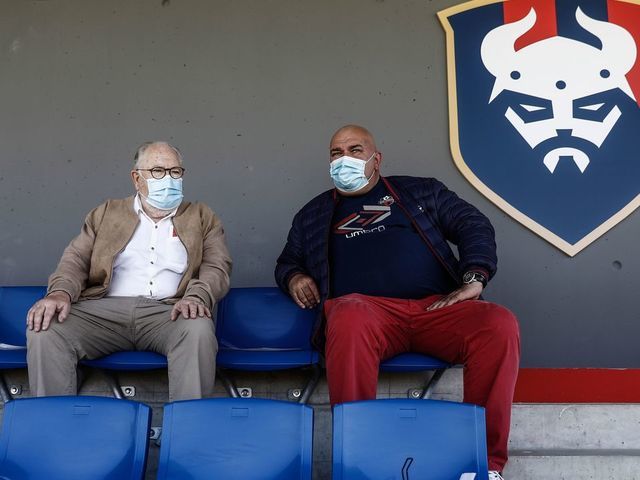 Caen football fans wearing a protective face mask attend the French L2 friendly football match between Caen and Paris FC at the Michel d'Ornano Stadium in Caen, northwestern France on July 11, 2020. - Today on July 11, 2020, the green light was given to football clubs to organize matches with the public, and with a gauge limited to 5,000 people as France eases lockdown measures taken to curb the spread of the COVID-19 caused by the novel coronavirus.