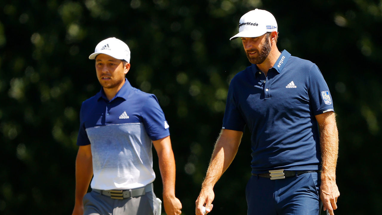 ATLANTA, GEORGIA - SEPTEMBER 07: Xander Schauffele of the United States and Dustin Johnson of the United States walk on the second hole during the final round of the TOUR Championship at East Lake Golf Club on September 07, 2020 in Atlanta, Georgia.