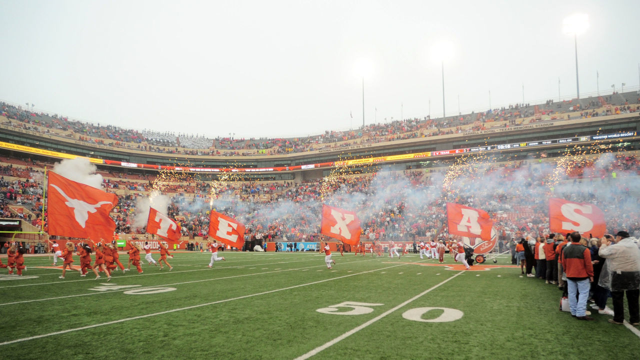 AUSTIN, TX - NOVEMBER 29: The Texas Longhorns spirit squad leads out the team prior to game against the Texas Tech Red Raiders on November 29, 2019 at Darrell K Royal-Texas Memorial Stadium in Austin, Texas.
