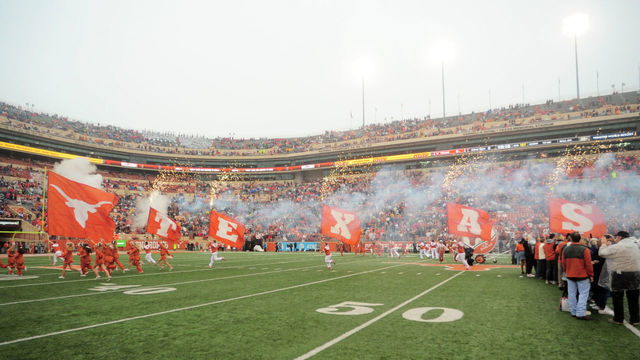 AUSTIN, TX - NOVEMBER 29: The Texas Longhorns spirit squad leads out the team prior to game against the Texas Tech Red Raiders on November 29, 2019 at Darrell K Royal-Texas Memorial Stadium in Austin, Texas.