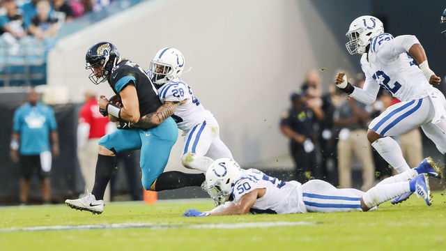 JACKSONVILLE, FLORIDA - DECEMBER 29: Gardner Minshew II #15 of the Jacksonville Jaguars is tackled by Briean Boddy-Calhoun #28 of the Indianapolis Colts during the second quarter of a game at TIAA Bank Field on December 29, 2019 in Jacksonville, Florida.