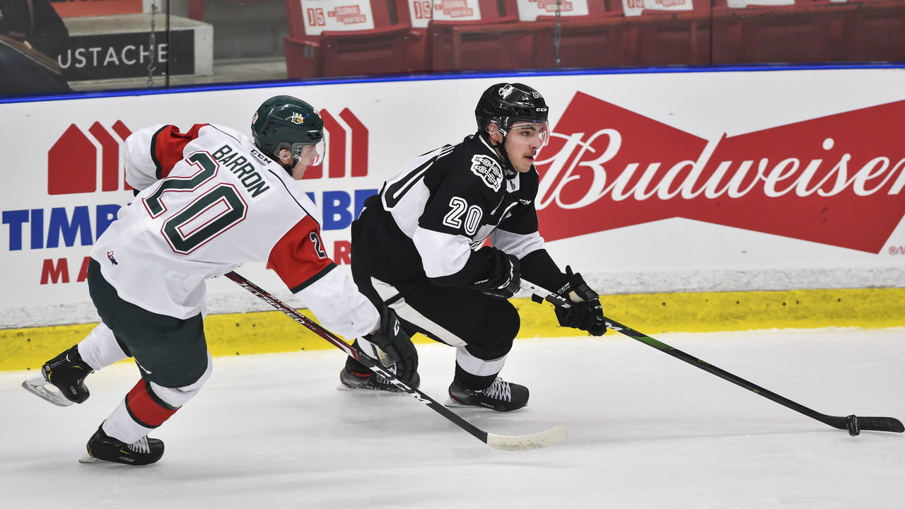 BOISBRIAND, QC - NOVEMBER 13: Adam Capannelli #20 of the Blainville-Boisbriand Armada skates the puck against Justin Barron #20 of the Halifax Mooseheads at Centre d'Excellence Sports Rousseau on November 13, 2019 in Boisbriand, Canada.