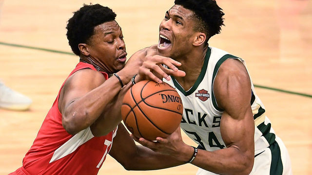 MILWAUKEE, WISCONSIN - MAY 23: Giannis Antetokounmpo #34 of the Milwaukee Bucks dribbles the ball while being guarded by Kyle Lowry #7 of the Toronto Raptors in the second quarter during Game Five of the Eastern Conference Finals of the 2019 NBA Playoffs at the Fiserv Forum on May 23, 2019 in Milwaukee, Wisconsin.