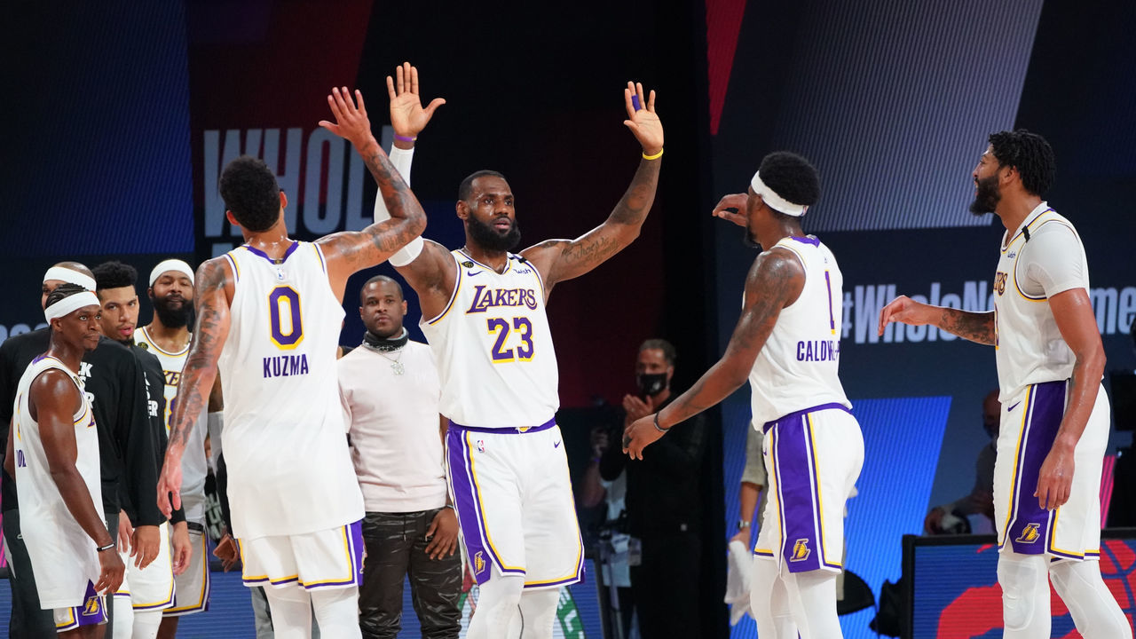 ORLANDO, FL - SEPTEMBER 8: LeBron James #23 of the Los Angeles Lakers high-fives his teammates during a game against the Houston Rockets during Round Two, Game Three of the Western Conference Semifinals on September 8, 2020 at the AdventHealth Arena at ESPN Wide World Of Sports Complex in Orlando, Florida. NOTE TO USER: User expressly acknowledges and agrees that, by downloading and/or using this Photograph, user is consenting to the terms and conditions of the Getty Images License Agreement. Mandatory Copyright Notice: Copyright 2020 NBAE