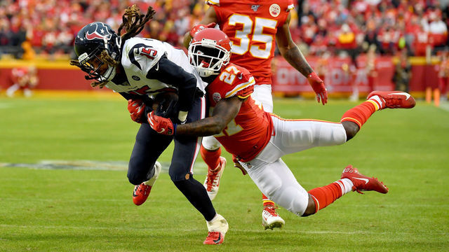 KANSAS CITY, MISSOURI - JANUARY 12: Will Fuller #15 of the Houston Texans is tackled by Rashad Fenton #27 of the Kansas City Chiefs during the AFC Divisional playoff game at Arrowhead Stadium on January 12, 2020 in Kansas City, Missouri.