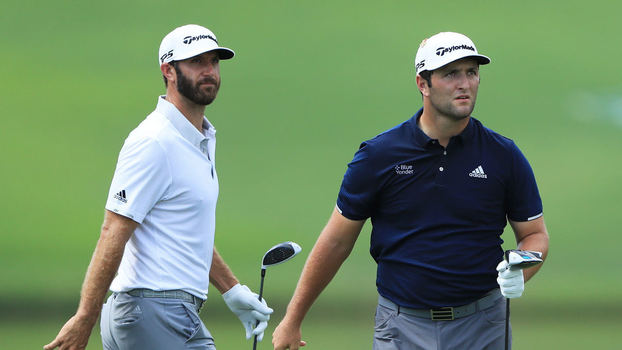 ATLANTA, GEORGIA - SEPTEMBER 05: Dustin Johnson of the United States and Jon Rahm of Spain look on from the fourth tee during the second round of the TOUR Championship at East Lake Golf Club on September 05, 2020 in Atlanta, Georgia.