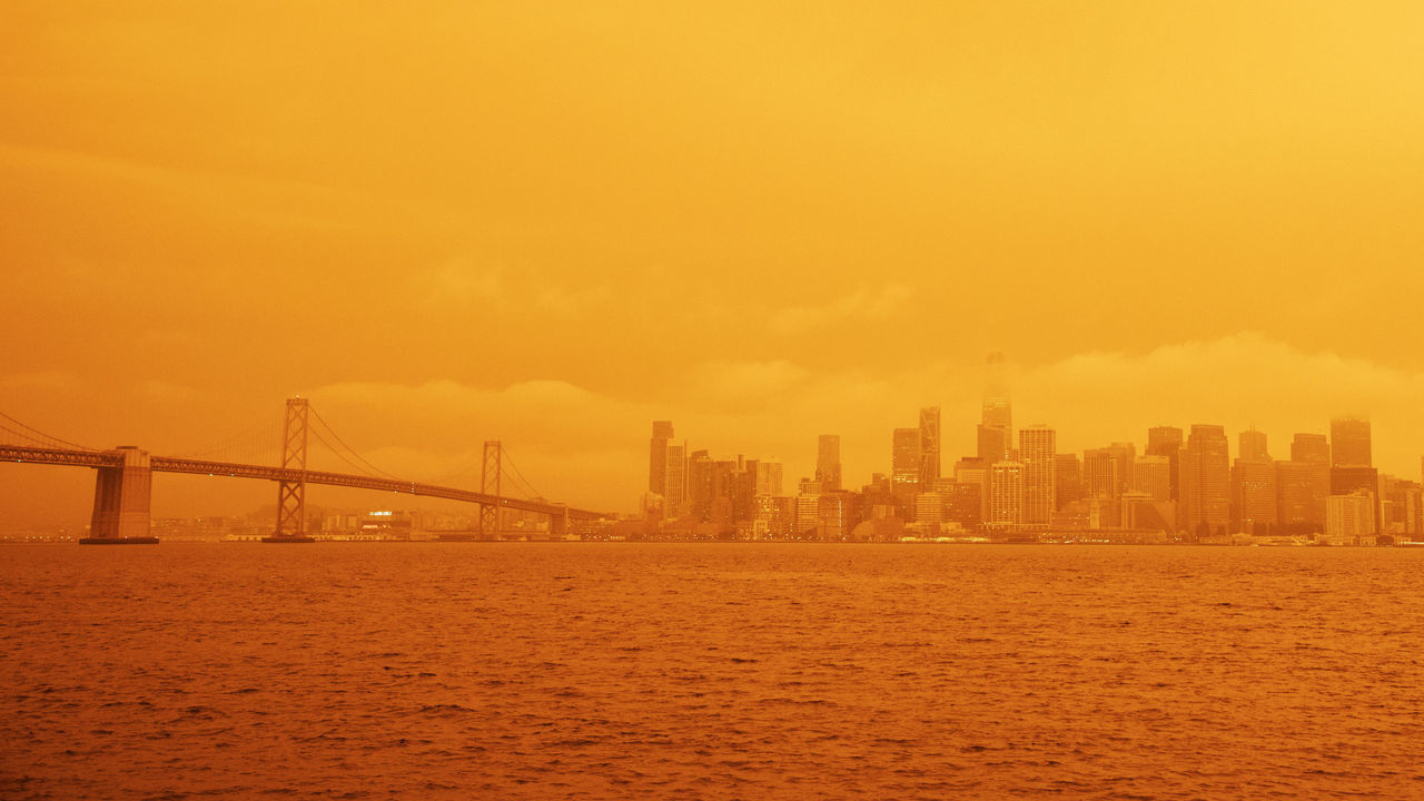 SAN FRANCISCO, USA - SEPTEMBER 09: A view of a layer of smoke generated by the over 2 dozen wildfires burning in California created and eerie orange glow over mush of the San Francisco Bay Area, California, United States on September 09, 2020. Fortunately a marine layer kept the smoke well above the ground improving air quality in the area.
