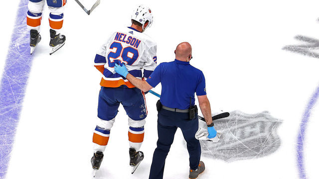 EDMONTON, ALBERTA - SEPTEMBER 09: Brock Nelson #29 of the New York Islanders is tended to by the trainer after sustaining an injury on a boarding penalty by Alex Killorn (not pictured) of the Tampa Bay Lightning during the first period in Game Two of the Eastern Conference Final during the 2020 NHL Stanley Cup Playoffs at Rogers Place on September 09, 2020 in Edmonton, Alberta, Canada.