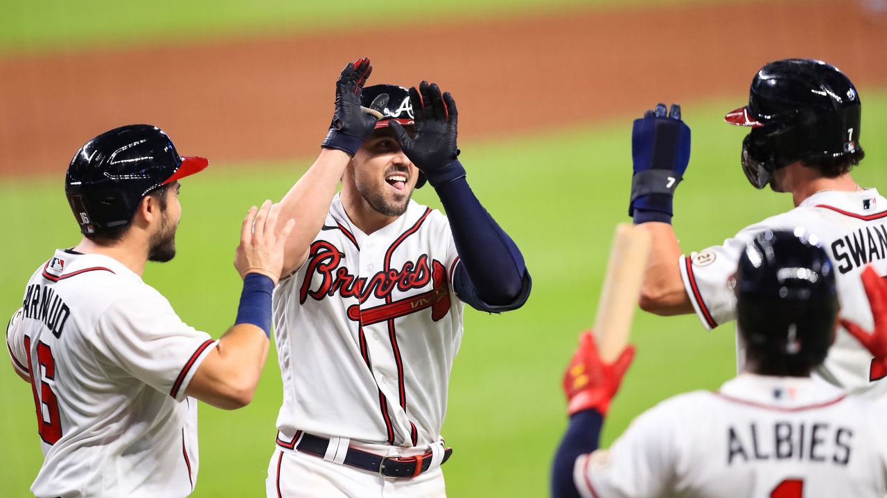 ATLANTA, GEORGIA - SEPTEMBER 09: Adam Duvall #23 of the Atlanta Braves celebrates with his teammates after hitting a grand slam during the seventh inning of a game against the Miami Marlins at Truist Park on September 9, 2020 in Atlanta, Georgia.