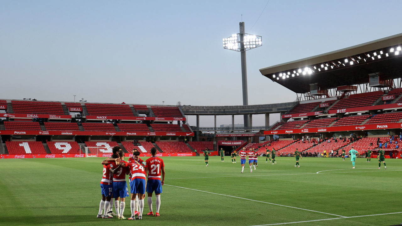 GRANADA, SPAIN - JULY 19: General view as Roberto Soldado of Granada celebrates after scoring his sides first goal with his team mates in an empty stadium during the Liga match between Granada CF and Athletic Club at Nuevo Los Carmenes stadium on July 19, 2020 in Granada, Spain. Football Stadiums around Europe remain empty due to the Coronavirus Pandemic as Government social distancing laws prohibit fans inside venues resulting in all fixtures being played behind closed doors.