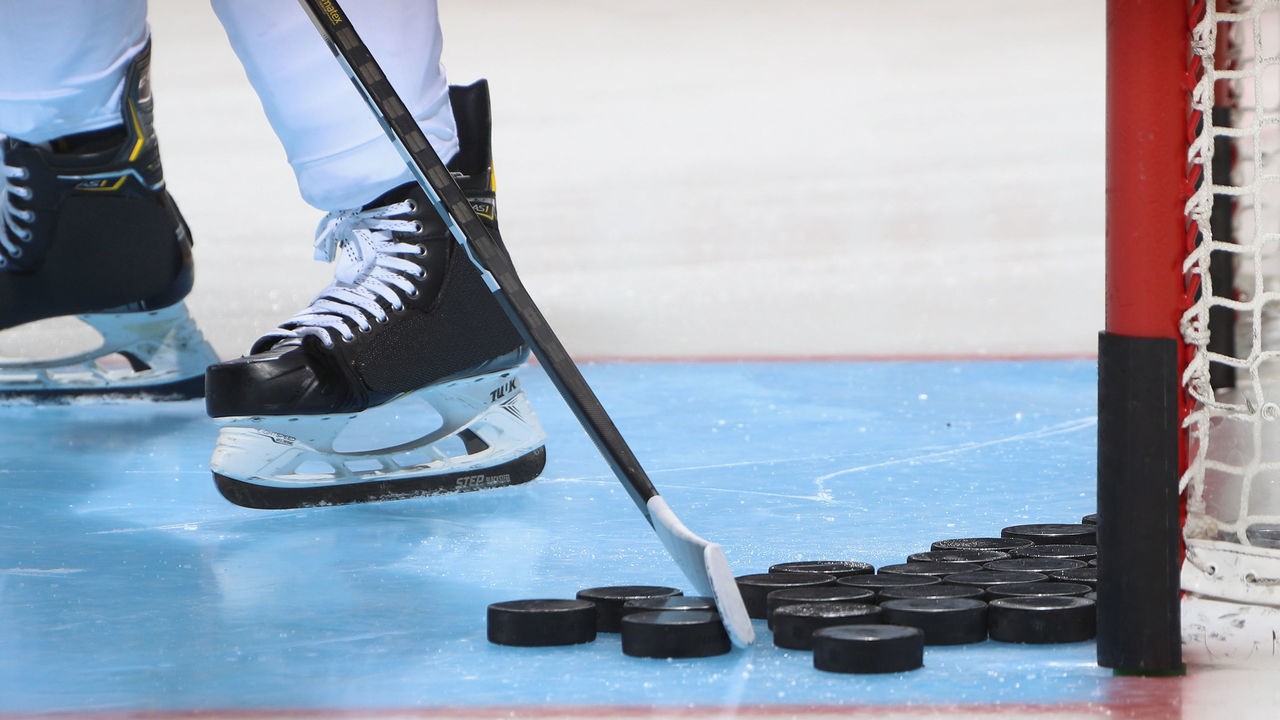 UNIONDALE, NEW YORK - SEPTEMBER 17: A closeup of pucks, a stick and skates as photographed during warm-ups prior to the game between the New York Islanders and the Philadelphia Flyers at the Nassau Veterans Memorial Coliseum on September 17, 2019 in Uniondale, New York. The Islanders defeated the Flyers 3-2 in overtime.