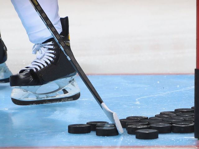 UNIONDALE, NEW YORK - SEPTEMBER 17: A closeup of pucks, a stick and skates as photographed during warm-ups prior to the game between the New York Islanders and the Philadelphia Flyers at the Nassau Veterans Memorial Coliseum on September 17, 2019 in Uniondale, New York. The Islanders defeated the Flyers 3-2 in overtime.