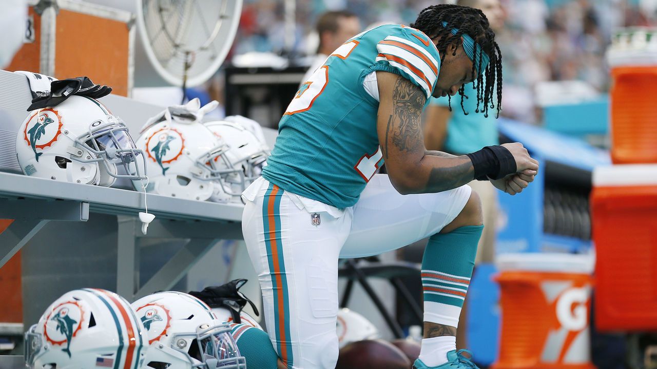 MIAMI, FLORIDA - DECEMBER 01: Albert Wilson #15 of the Miami Dolphins kneels during the playing of the national anthem prior to the game against the Philadelphia Eagles at Hard Rock Stadium on December 01, 2019 in Miami, Florida.