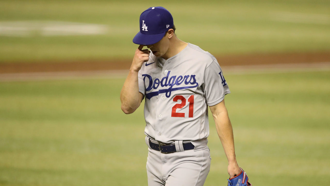 PHOENIX, ARIZONA - SEPTEMBER 08: Starting pitcher Walker Buehler #21 of the Los Angeles Dodgers walks to the dugout after being removed during the third inning of the MLB game against the Arizona Diamondbacks at Chase Field on September 08, 2020 in Phoenix, Arizona.