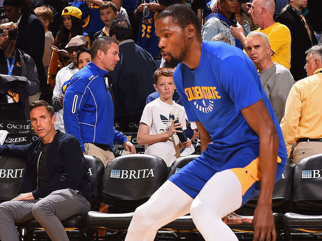 OAKLAND, CA - MARCH 27: NBA Legend, Steve Nash watches Kevin Durant #35 of the Golden State Warriors warm up before the game against the Indiana Pacers on March 27, 2018 at ORACLE Arena in Oakland, California. NOTE TO USER: User expressly acknowledges and agrees that, by downloading and or using this photograph, user is consenting to the terms and conditions of Getty Images License Agreement. Mandatory Copyright Notice: Copyright 2018 NBAE