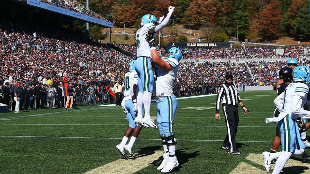 WEST POINT, NY - OCTOBER 05: Tulane Green Wave running back Corey Dauphine (6) celebrates with teammate Tulane Green Wave offensive lineman Ben Knutson (65) after he scores a touchdown during the College Football Game between the Army Black Knights and the Tulane Green Wave on October 5, 2019 at Michie Stadium in West Point, NY.