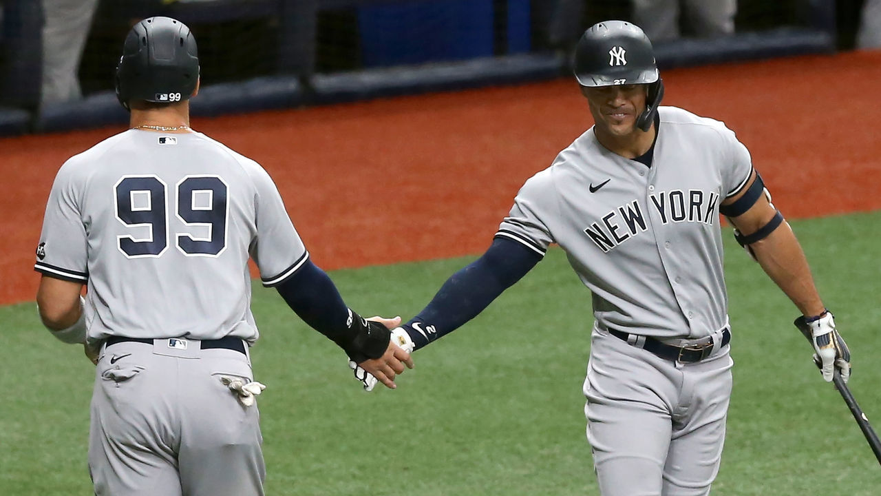 ST. PETERSBURG, FL - AUGUST 08: Aaron Judge (99) of the Yankees is congratulated upon scoring a run by Giancarlo Stanton (27) during the 1st game of the doubleheader between the New York Yankees and Tampa Bay Rays on August 08, 2020 at Tropicana Field in St. Petersburg, FL.