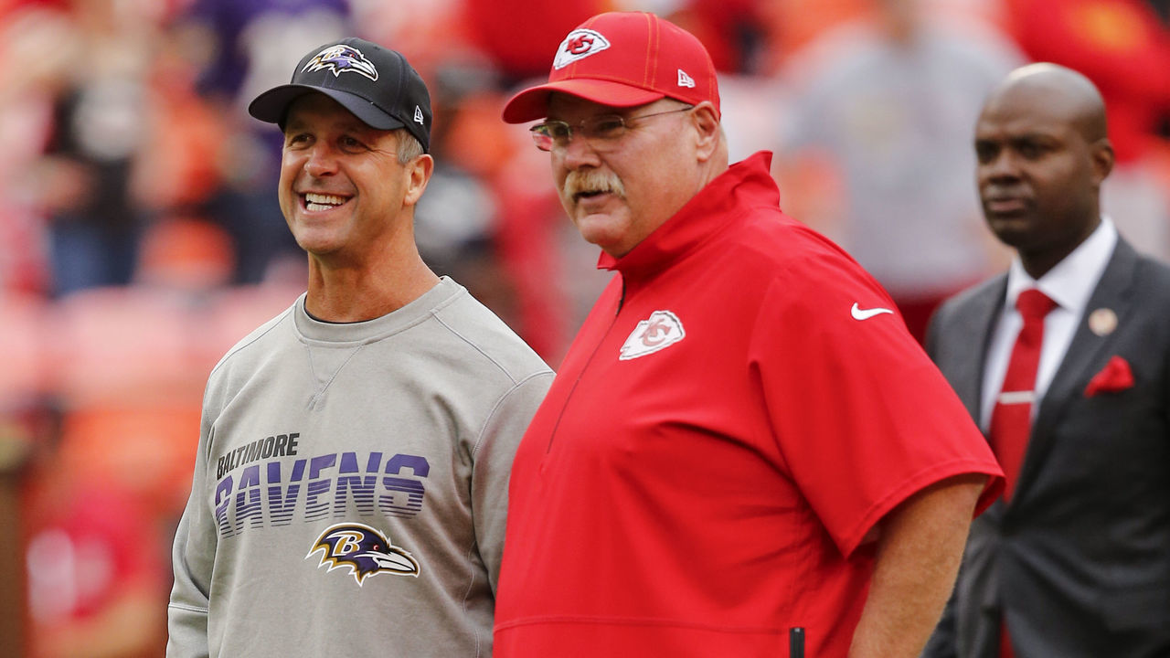 KANSAS CITY, MO - SEPTEMBER 22: Head coach John Harbaugh of the Baltimore Ravens smiles while speaking with head coach Andy Reid of the Kansas City Chiefs prior to their game at Arrowhead Stadium on September 22, 2019 in Kansas City, Missouri.
